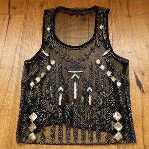 Black and gold mesh beat it and sequenced tank top. Size medium.